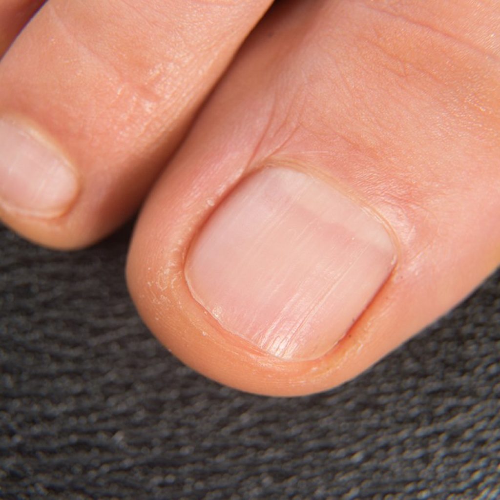 Close-up shot of beautiful woman feet with natural pedicure. High quality photo